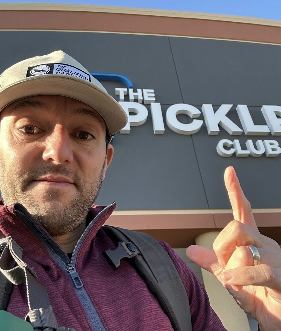 Mike Manzella outside The Pickle Club facility signage